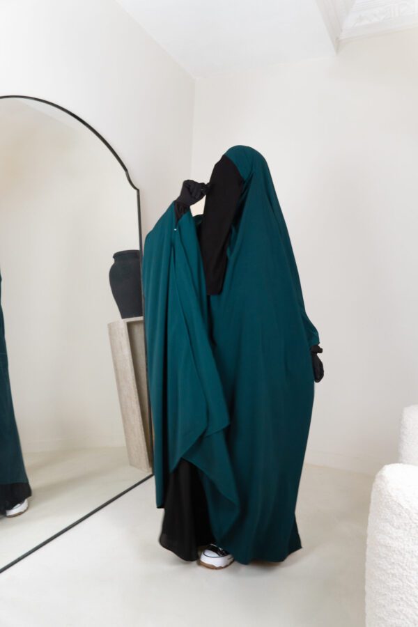 a woman in a green dress